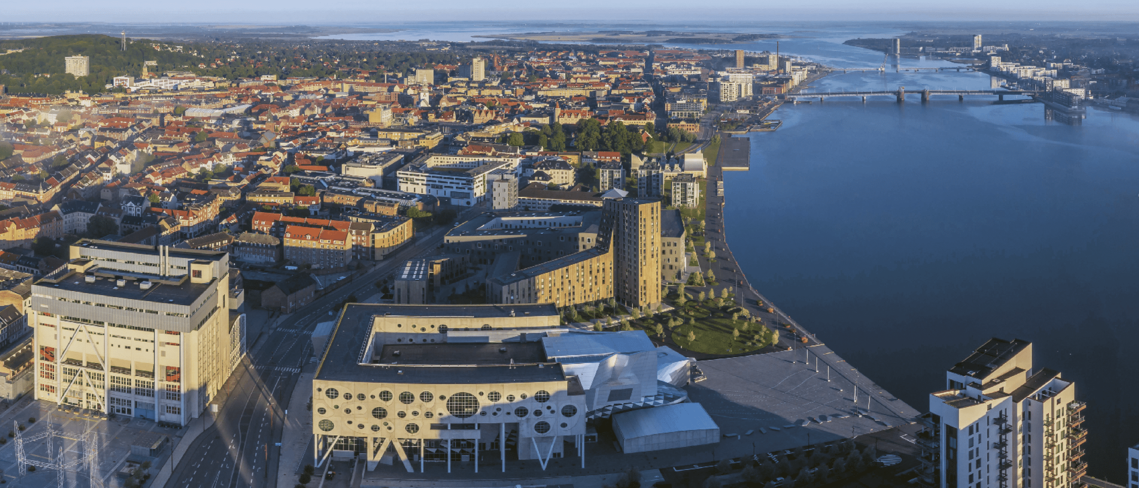 A beautiful view of a city with a large body of water. Description generated by AI